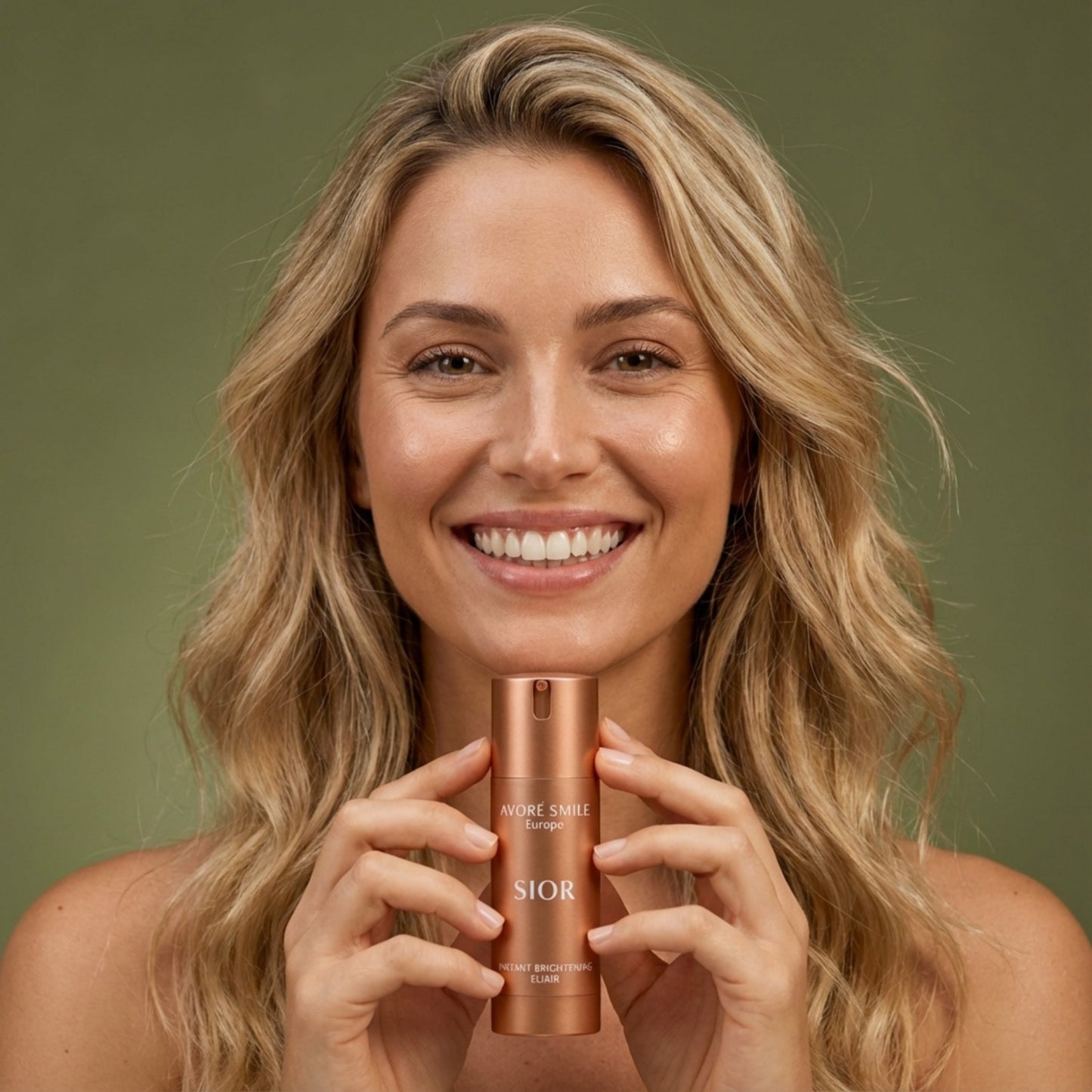 Female model holding Avoré Smile Soír instant brightening bottle against green background